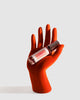 Shocks of Love Orange Blossoms Body Oil Roller Displayed on a Red Mannequin Hand