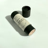Black cardboard tube of Rosie Vegan Lip Balm from Live Like You Green It on a white background 